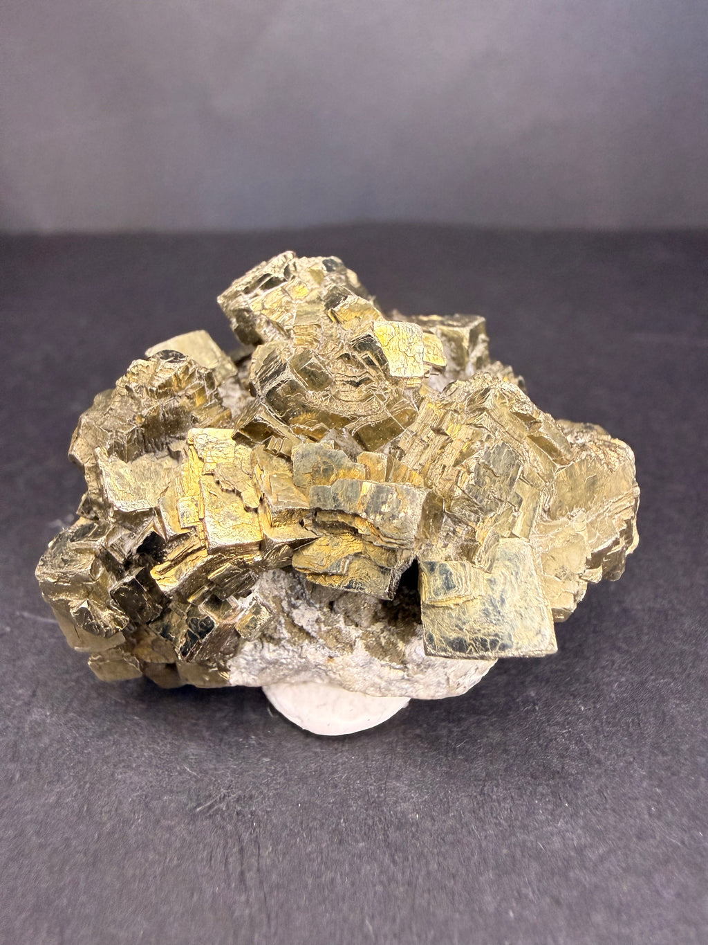 Pyrite cluster close-up showing mirror-like crystal faces, Gisborne New Zealand