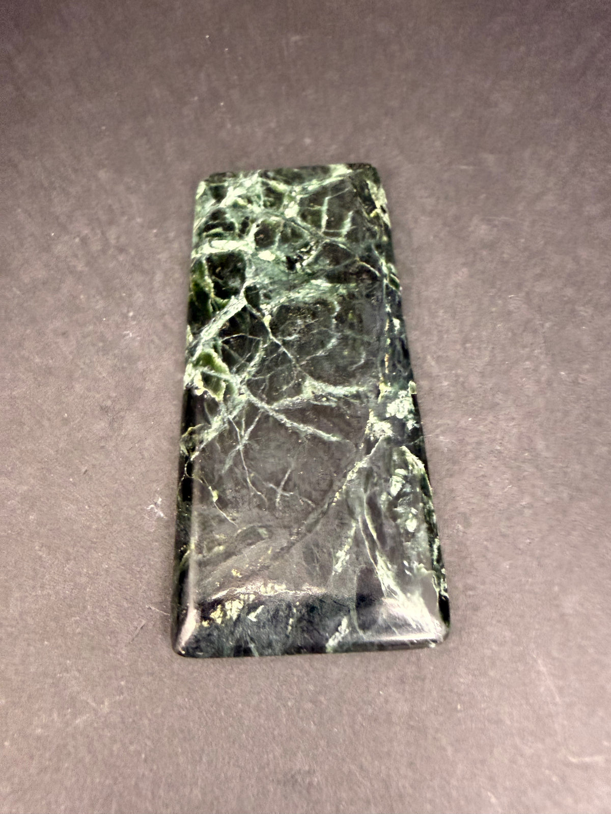 Polished serpentine and pounamu slab from Hokitika, New Zealand, dark green with white veining