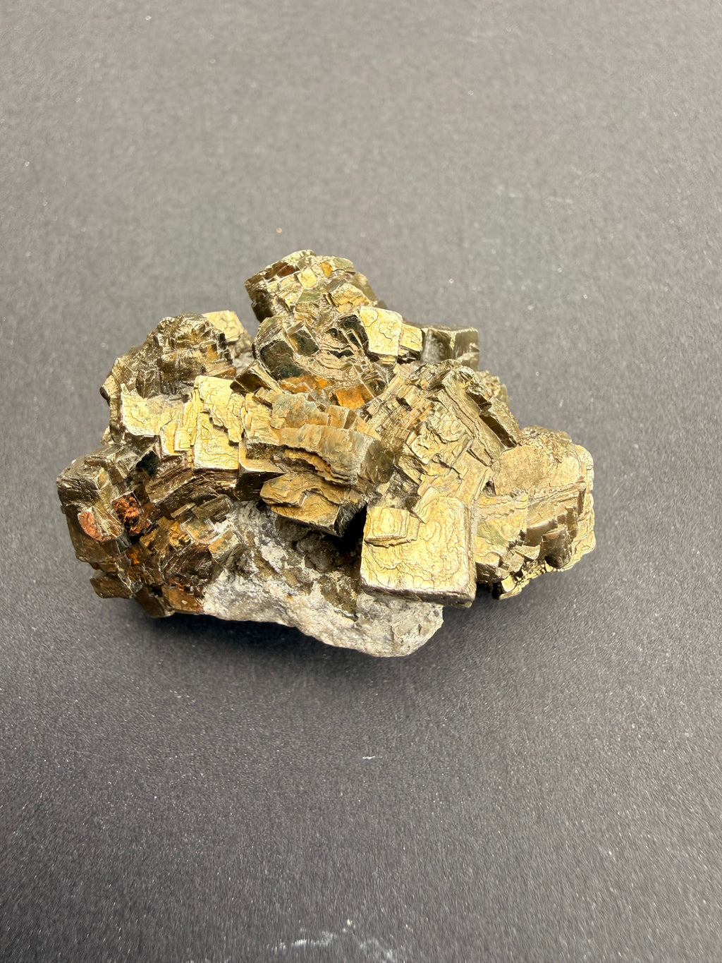Large NZ pyrite cluster with bright metallic cubic crystals on host rock base