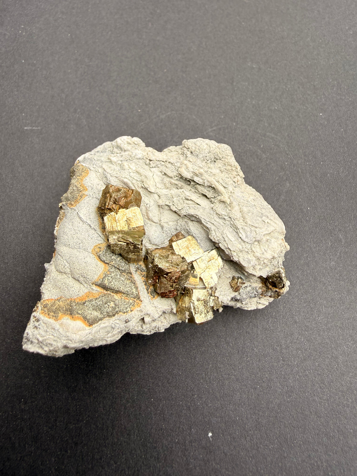 Pyrite crystals on natural host rock matrix, New Zealand specimen