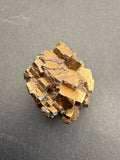 Oxidised pyrite cluster specimen with golden-brown ocean-weathered patina, New Zealand