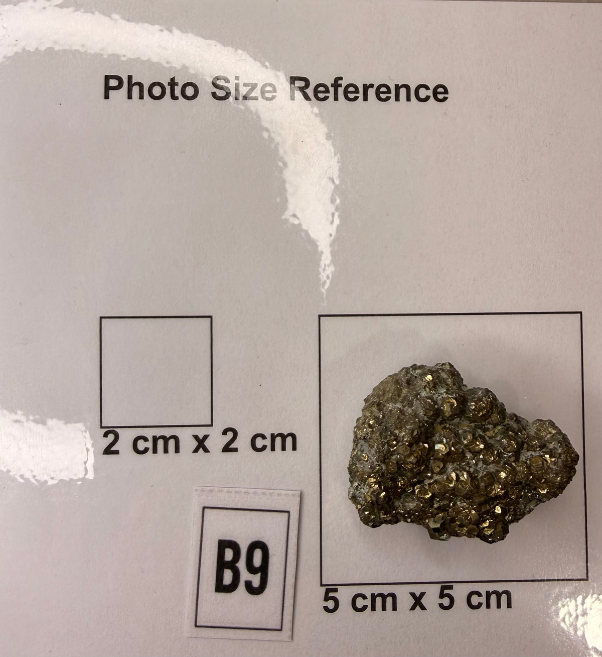 Pyritohedron pyrite cluster, full specimen view on grey background