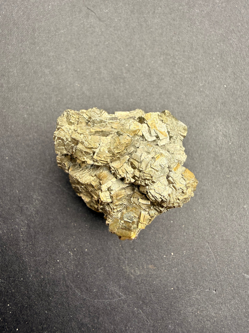 Two-tone pyrite cluster close-up showing gold crystal faces