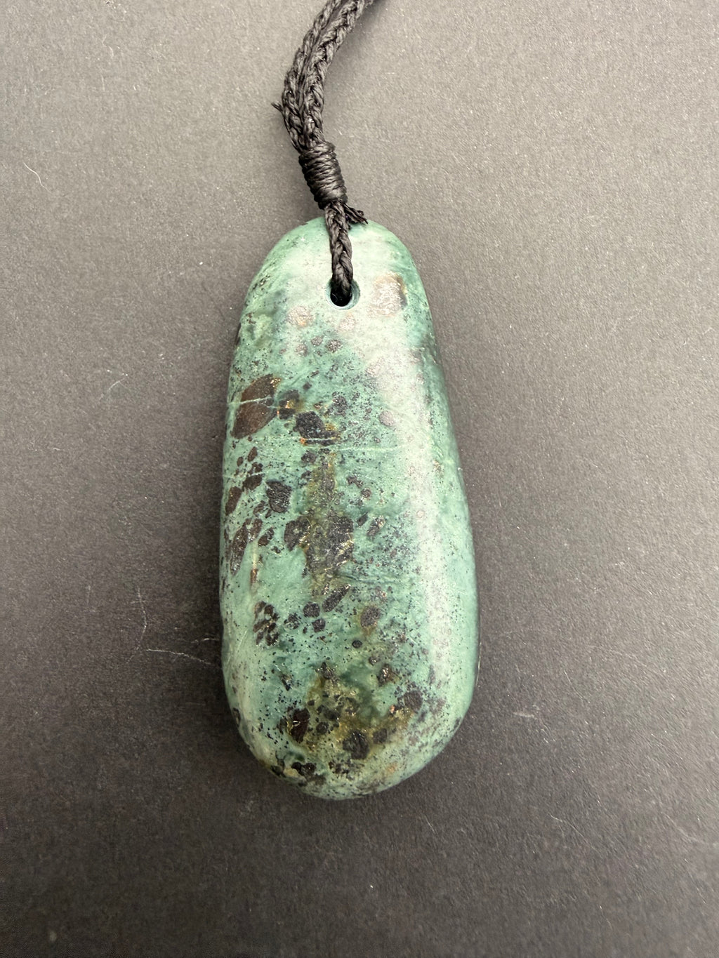 Close-up of serpentine jade mix necklace showing natural colour variation
