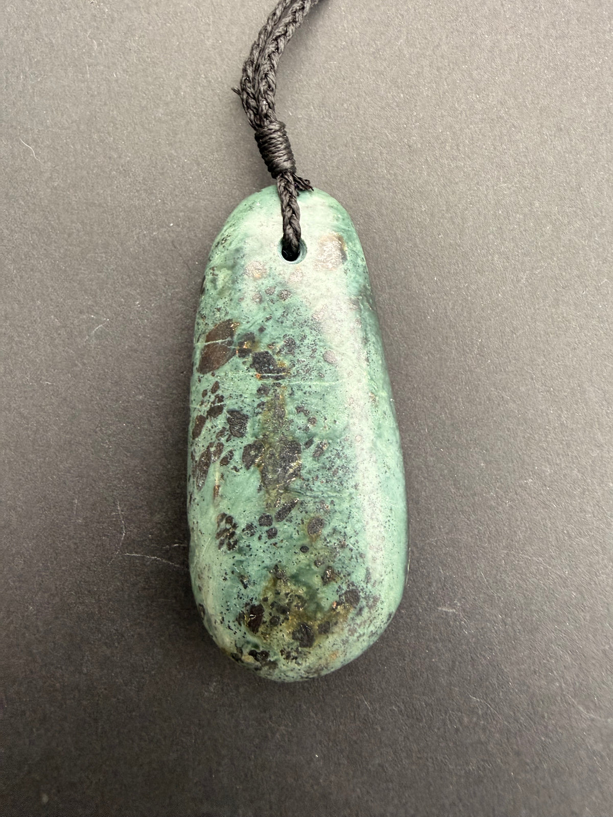 Close-up of serpentine jade mix necklace showing natural colour variation