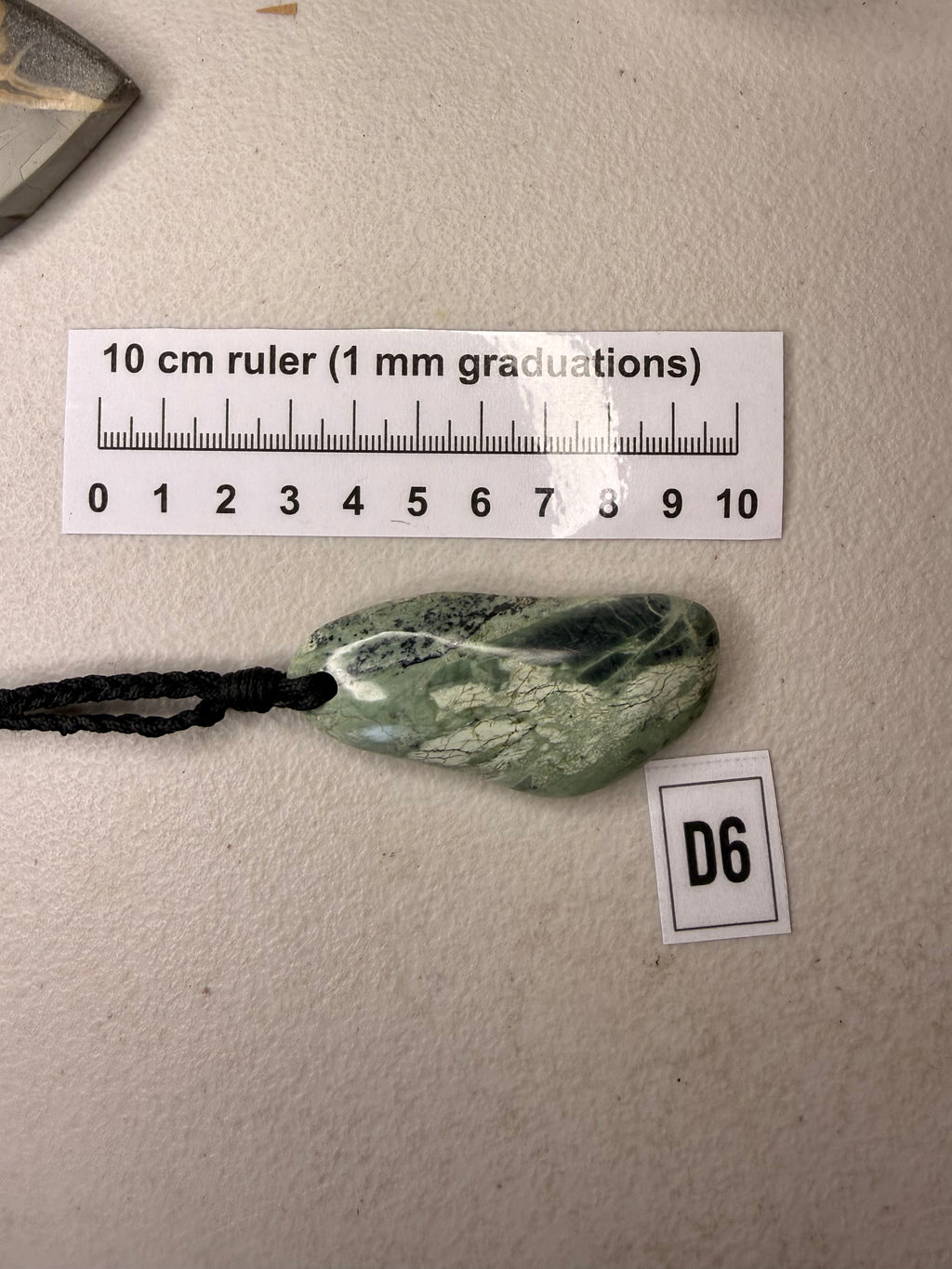 Serpentine necklace pendant on cord, full view