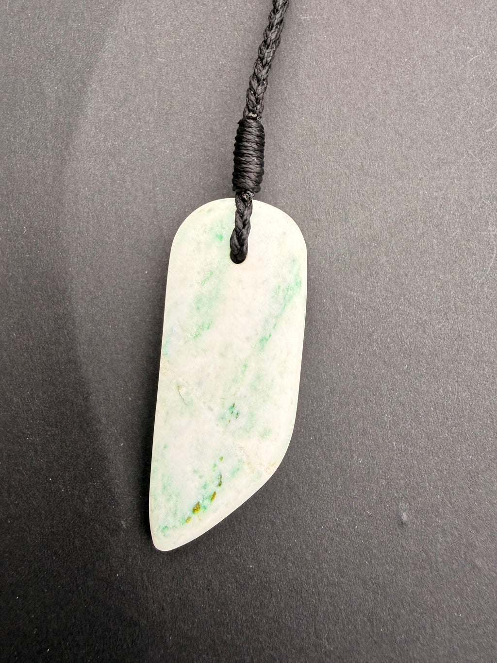 Aotea Stone necklace pendant close-up showing green and white mineral banding