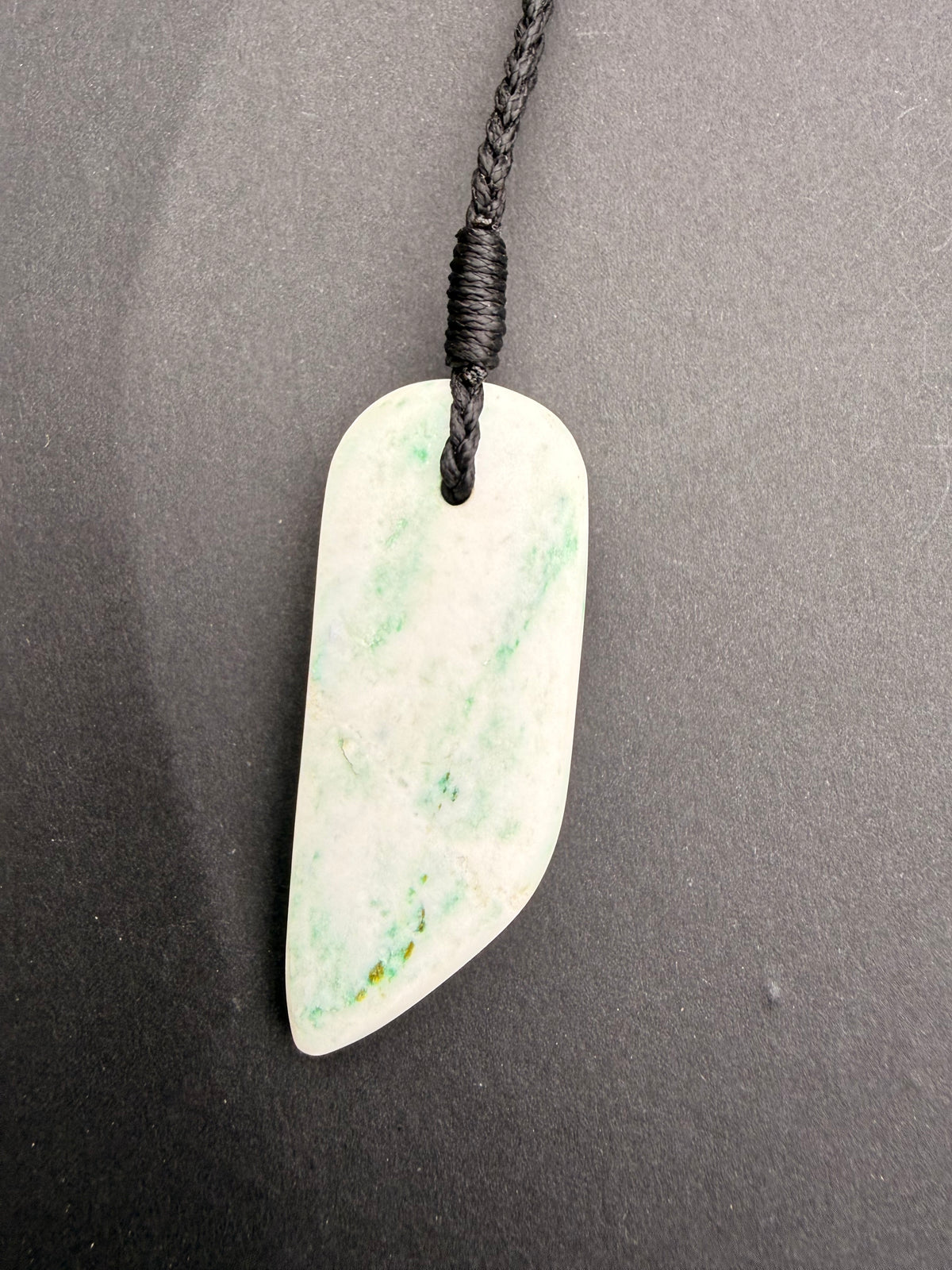 Aotea Stone necklace pendant close-up showing green and white mineral banding