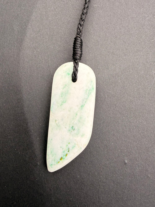 Aotea Stone necklace pendant close-up showing green and white mineral banding