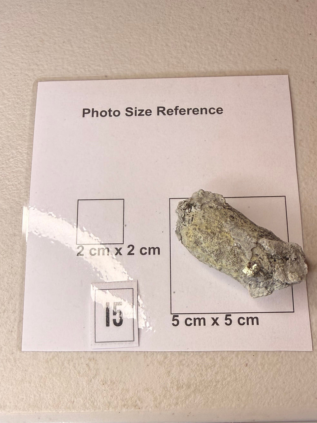 Small pyrite crystal on host rock, alternate angle, New Zealand specimen