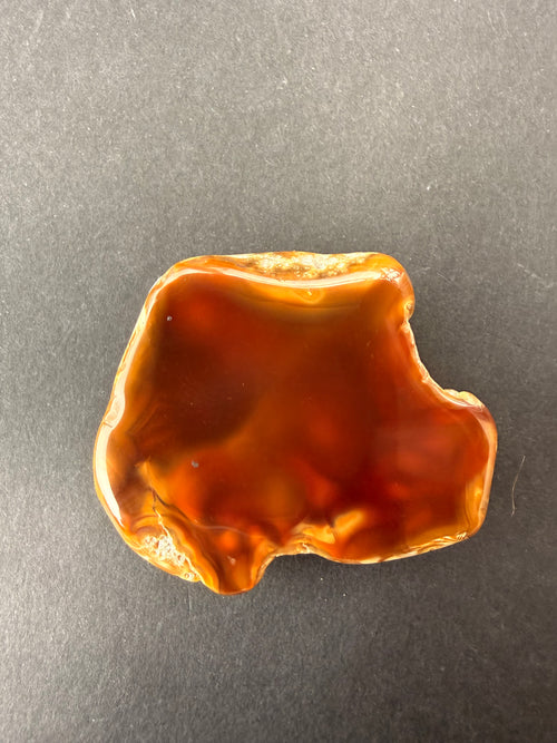 Carnelian Agate specimen tumbled by Gary Howes, deep orange natural pattern, Thames New Zealand